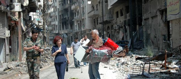 Syrians residents of Homs return to the old town of Syria's central city (File) Syrians residents of Homs return to the old town of Syria's central city (File) - Sputnik International