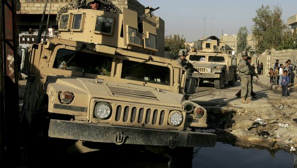 U.S. Army soldiers of Lightning Troop, 3rd Squadron, 3rd Armored Cavalry Regiment, make their way across a street flooded with sewage with their military vehicles, during a routine patrol in Al Islah Al Serai neighborhood, northwestern Mosul, 360 kilometers (224 miles) northwest of Baghdad, Iraq (File) U.S. Army soldiers of Lightning Troop, 3rd Squadron, 3rd Armored Cavalry Regiment, make their way across a street flooded with sewage with their military vehicles, during a routine patrol in Al Islah Al Serai neighborhood, northwestern Mosul, 360 kilometers (224 miles) northwest of Baghdad, Iraq (File) - Sputnik International