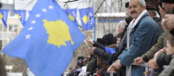 Kosovo Albanians wave the Kosovo flag during a celebration marking the 4th anniversary of the Kosovo's declaration of independence in Pristina on February 17, 2012 - Sputnik International