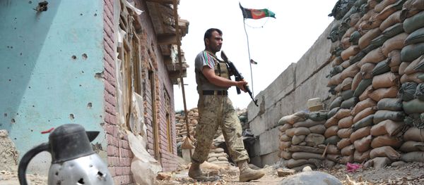 An Afghan security serviceman keep watch at a damaged police post following an airstrike in Bati Kot district in Nangarhar province (File) An Afghan security serviceman keep watch at a damaged police post following an airstrike in Bati Kot district in Nangarhar province (File) - Sputnik International