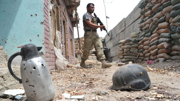 An Afghan security serviceman keep watch at a damaged police post following an airstrike in Bati Kot district in Nangarhar province (File) An Afghan security serviceman keep watch at a damaged police post following an airstrike in Bati Kot district in Nangarhar province (File) - Sputnik International