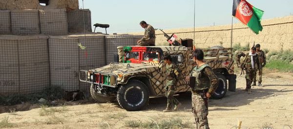 Afghan National Army (ANA) soldiers stand next to an outpost where 12 soldiers were killed by their comrades in the northern city of Kunduz, Afghanistan September 27, 2016 - Sputnik International