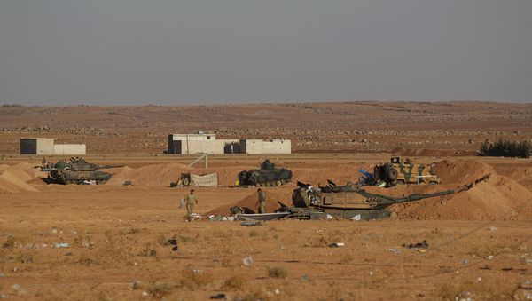 Turkish army soldiers walk past their tanks and armored vehicles in the northern Syrian rebel-controlled town of al-Rai, in Aleppo Governorate, Syria, September 27, 2016 Turkish army soldiers walk past their tanks and armored vehicles in the northern Syrian rebel-controlled town of al-Rai, in Aleppo Governorate, Syria, September 27, 2016 - Sputnik International