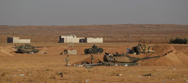 Turkish army soldiers walk past their tanks and armored vehicles in the northern Syrian rebel-controlled town of al-Rai, in Aleppo Governorate, Syria, September 27, 2016 Turkish army soldiers walk past their tanks and armored vehicles in the northern Syrian rebel-controlled town of al-Rai, in Aleppo Governorate, Syria, September 27, 2016 - Sputnik International