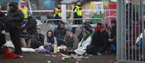 Migrants sit on the ground before leaving an illegal camp set up in Malmo (file) Migrants sit on the ground before leaving an illegal camp set up in Malmo (file) - Sputnik International