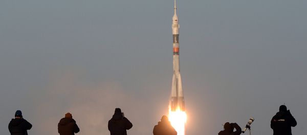 The launch of a Soyuz-FG rocket with the Soyuz TMA-19M manned spacecraft from the Baikonur Space Center. - Sputnik International