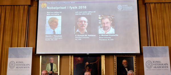 Members of the Royal Academy of Sciences, Nils Martensson (L-R), Goran K Hansson and Thomas Hans Hansson, sit under a screen showing pictures of the winners of the 2016 Nobel Prize for Physics during a news conference in Stockholm, Sweden October 4, 2016. Top from left: David Thouless, Duncan Haldane and Michael Kosterlitz. Members of the Royal Academy of Sciences, Nils Martensson (L-R), Goran K Hansson and Thomas Hans Hansson, sit under a screen showing pictures of the winners of the 2016 Nobel Prize for Physics during a news conference in Stockholm, Sweden October 4, 2016. Top from left: David Thouless, Duncan Haldane and Michael Kosterlitz. - Sputnik International