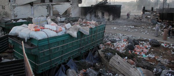aid strewn across the floor in the town of Orum al-Kubra on the western outskirts of the northern Syrian city of Aleppo, the morning after a convoy delivering aid was hit by a deadly air strike. - Sputnik International