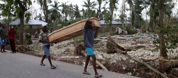 Men carry a coffin after Hurricane Matthew hit Cavaillon, Haiti, October 6, 2016 Men carry a coffin after Hurricane Matthew hit Cavaillon, Haiti, October 6, 2016 - Sputnik International