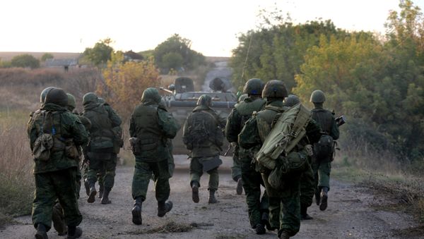 Pro-Russian troops leave their position during withdrawal in the village of Petrovske, some 50 km from Donetsk, on October 3, 2016 Pro-Russian troops leave their position during withdrawal in the village of Petrovske, some 50 km from Donetsk, on October 3, 2016 - Sputnik International
