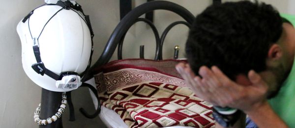 A member of the Civil Defence, also known as the 'White Helmets', who have been nominated for the 2016 Nobel Peace Prize, reacts after the announcemenet of the winner, in a rebel held area of Aleppo, Syria October 7, 2016 - Sputnik International