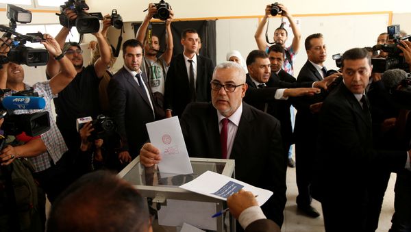 Abdelillah Benkirane, secretary-general of the Islamist Justice and Development party (PJD), casts his ballot at a polling station in Rabat October 7, 2016 - Sputnik International