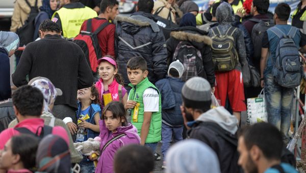 Migrants arrive at the railway station in Munich, southern Germany, on September 12, 2015 - Sputnik International