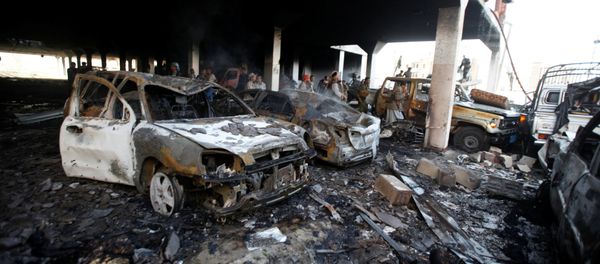 People stand at the site of an airstrike which witnesses said was by Saudi-led coalition aircraft on mourners at a hall where a wake for the father of Jalal al-Roweishan, the interior minister in the Houthi-dominated Yemeni government, was being held, in Sanaa, Yemen October 8, 2016 People stand at the site of an airstrike which witnesses said was by Saudi-led coalition aircraft on mourners at a hall where a wake for the father of Jalal al-Roweishan, the interior minister in the Houthi-dominated Yemeni government, was being held, in Sanaa, Yemen October 8, 2016 - Sputnik International