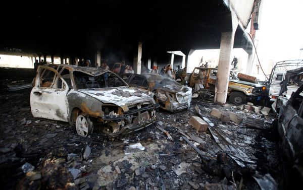 People stand at the site of an airstrike which witnesses said was by Saudi-led coalition aircraft on mourners at a hall where a wake for the father of Jalal al-Roweishan, the interior minister in the Houthi-dominated Yemeni government, was being held, in Sanaa, Yemen October 8, 2016 People stand at the site of an airstrike which witnesses said was by Saudi-led coalition aircraft on mourners at a hall where a wake for the father of Jalal al-Roweishan, the interior minister in the Houthi-dominated Yemeni government, was being held, in Sanaa, Yemen October 8, 2016 - Sputnik International