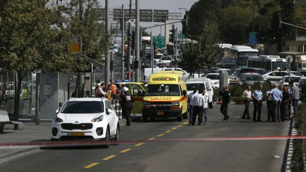 Israeli security forces cordon off the site of a shooting attack near Israeli police headquarters, close to the line dividing mainly Palestinian east Jerusalem from the mostly Jewish western sector of the city, on October 9, 2016 - Sputnik International