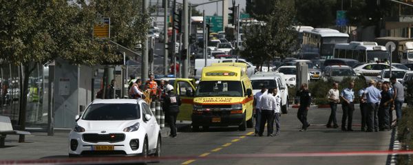 Israeli security forces cordon off the site of a shooting attack near Israeli police headquarters, close to the line dividing mainly Palestinian east Jerusalem from the mostly Jewish western sector of the city, on October 9, 2016 - Sputnik International