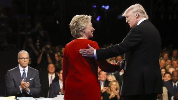 In this Sept. 26, 2016 file photo, Democratic presidential nominee Hillary Clinton and Republican presidential nominee Donald Trump shake hands during the presidential debate at Hofstra University in Hempstead, N.Y. - Sputnik International
