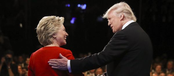 In this Sept. 26, 2016 file photo, Democratic presidential nominee Hillary Clinton and Republican presidential nominee Donald Trump shake hands during the presidential debate at Hofstra University in Hempstead, N.Y. - Sputnik International