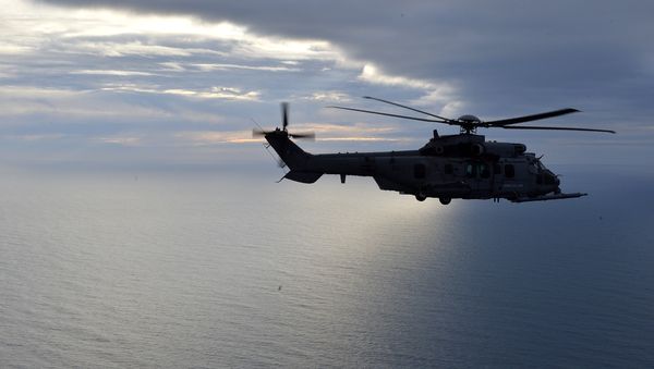 This picture taken on February 24, 2016, shows a French Caracal helicopter flying offshore during an air-to-air refuelling exercise. - Sputnik International