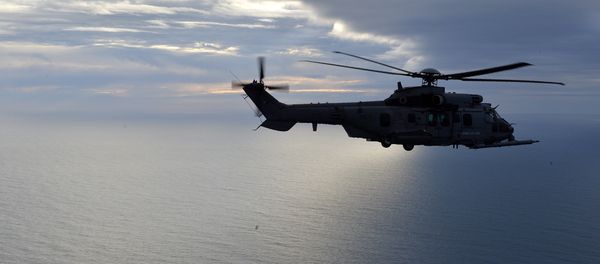 This picture taken on February 24, 2016, shows a French Caracal helicopter flying offshore during an air-to-air refuelling exercise. This picture taken on February 24, 2016, shows a French Caracal helicopter flying offshore during an air-to-air refuelling exercise. - Sputnik International