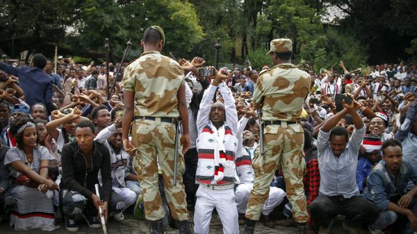 In this photo taken on Sunday, Oct. 2, 2016, Ethiopian soldiers try to stop protesters in Bishoftu, Ethiopia In this photo taken on Sunday, Oct. 2, 2016, Ethiopian soldiers try to stop protesters in Bishoftu, Ethiopia - Sputnik International