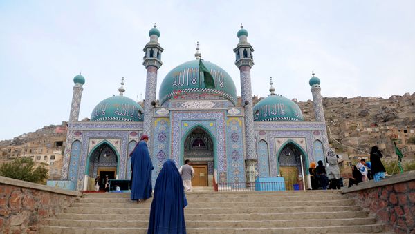 Afghan burqa-clad women visit The Karte Sakhi Shrine in Kabul Afghan burqa-clad women visit The Karte Sakhi Shrine in Kabul - Sputnik International