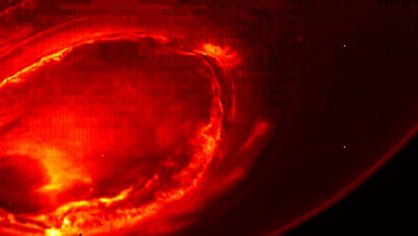 This Aug. 27, 2016 infrared image provided by NASA shows the southern aurora of Jupiter, captured by NASA's Juno spacecraft. The image is a mosaic of three photographs made as the spacecraft was moving away from the gas giant. (NASA/JPL-Caltech/SwRI/MSSS via AP) - Sputnik International
