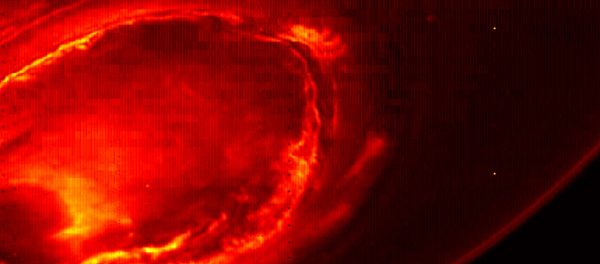 This Aug. 27, 2016 infrared image provided by NASA shows the southern aurora of Jupiter, captured by NASA's Juno spacecraft. The image is a mosaic of three photographs made as the spacecraft was moving away from the gas giant. (NASA/JPL-Caltech/SwRI/MSSS via AP) - Sputnik International