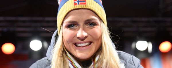 This file photo taken on February 28, 2015 shows Norway's Therese Johaug celebrating with her three gold medals during the medals ceremony of the women's cross country 30 km mass start classic style competition of the 2015 FIS Nordic World Ski Championships in Falun, Sweden. - Sputnik International