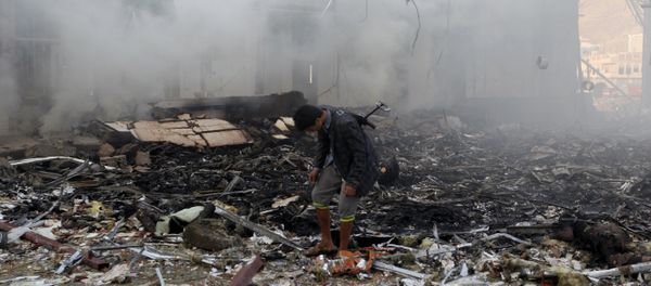 A Yemeni inspects the rubble of a destroyed building following an air strike on a funeral ceremony in the capital Sanaa on October 8, 2016 - Sputnik International