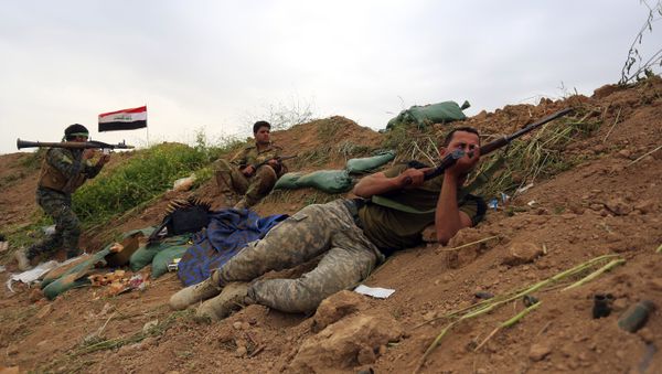 Iraqi Security forces and allied Popular Mobilization forces take combat positions during a military operation to regain control of Islamic State group held town of Besher outside the oil-rich city of Kirkuk (File) - Sputnik International
