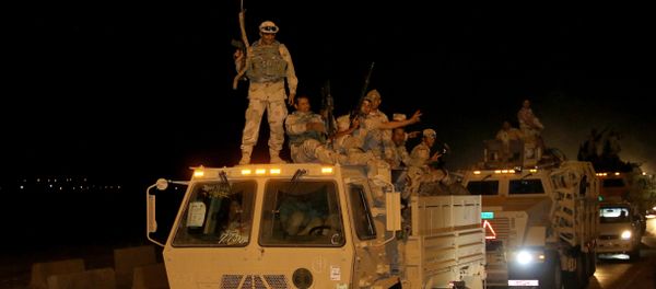 Iraqi army soldiers drive through the city of Kirkuk on October 10, 2016 as they head to the frontline in preparation for the battle to retake the city of Mosul Iraqi army soldiers drive through the city of Kirkuk on October 10, 2016 as they head to the frontline in preparation for the battle to retake the city of Mosul - Sputnik International