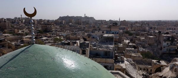 A view taken with a drone shows the minaret of Osama Bin Zayed mosque along with damaged buildings in the old city of Aleppo, Syria, October 13, 2016 A view taken with a drone shows the minaret of Osama Bin Zayed mosque along with damaged buildings in the old city of Aleppo, Syria, October 13, 2016 - Sputnik International