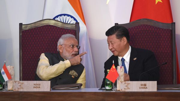 India Prime Minister Narendra Modi (L) gestures while talking with China's President Xi Jingping during the BRICS leaders' meeting with the BRICS Business Council at the Taj Exotica hotel in Goa on October 16, 2016 India Prime Minister Narendra Modi (L) gestures while talking with China's President Xi Jingping during the BRICS leaders' meeting with the BRICS Business Council at the Taj Exotica hotel in Goa on October 16, 2016 - Sputnik International
