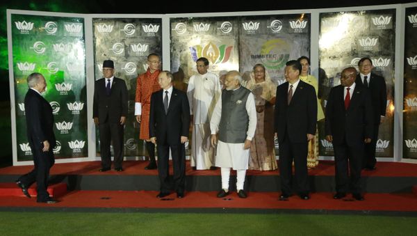 Brazilian President Michel Temer, left, walks to join leaders of BRICS countries, from left bottom row, Russian President Vladimir Putin, Indian Prime Minister Narendra Modi, Chinese President Xi Jinping, and South African President Jacob Zuma and BIMSTEC leaders, second row from left, Nepalese Prime Minister Pushpa Kamal Dahal, Bhutanese Prime Minister Tshering Tobgay, Sri Lankan President Maithripala Sirisena, Bangladesh Prime Minister Sheikh Hasina, Myanmar's Foreign Minister Aung San Suu Kyi and Thailand's Vice Minister for Foreign Affairs Virasakdi Futrakul, for a group photo at the BRICS and BIMSTEC, or Bay of Bengal Initiative for Multi-Sectoral Technical and Economic Cooperation, summit in Goa, India, Sunday, Oct. 16, 2016 - Sputnik International