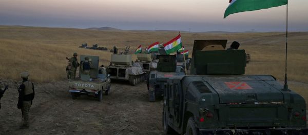 A Peshmerga convoy drives towards a frontline in Khazer, about 30 kilometers (19 miles) east of Mosul, Iraq, Monday, Oct. 17, 2016 - Sputnik International