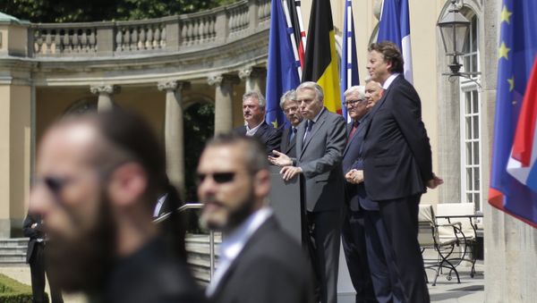 Security guards stand in front of he Foreign Ministers from EU's founding six Jean Asselborn from Luxemburg, Paolo Gentiloni from Italy, Jean-Marc Ayrault from France, Frank-Walter Steinmeier from Germany, Didier Reynders from Belgium and Bert Koenders from the Netherlands, as they brief the media after a meeting on the so-called Brexit in Berlin, Germany, Saturday, June 25, 2016 Security guards stand in front of he Foreign Ministers from EU's founding six Jean Asselborn from Luxemburg, Paolo Gentiloni from Italy, Jean-Marc Ayrault from France, Frank-Walter Steinmeier from Germany, Didier Reynders from Belgium and Bert Koenders from the Netherlands, as they brief the media after a meeting on the so-called Brexit in Berlin, Germany, Saturday, June 25, 2016 - Sputnik International