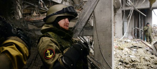 Arseny Pavlov, also known by his nickname 'Motorola', stands inside a destroyed airport building in the eastern Ukrainian city of Donetsk, on February 26, 2015 - Sputnik International