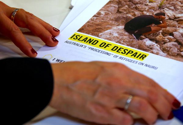 Anna Neistat, Senior Director for Research with Amnesty International, talks to journalists as she holds a copy of a report she co-authored titled 'Island of Despair - Australia's Processing of Refugees on Nauru' in Sydney, Australia, October 17, 2016 - Sputnik International