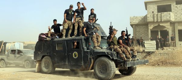 FILE -- In this Saturday, Oct. 15, 2016, file photo, Iraq's elite counterterrorism forces gather ahead of an operation to re-take the Islamic State-held City of Mosul, outside Irbil, Iraq - Sputnik International