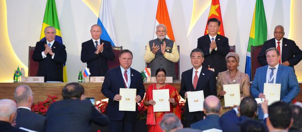 At this October 16, 2016 photo Russian President Vladimir Putin is seen at the ceremony of signing joint documents following a meeting of BRICS leaders at Taj Exotica Goa hotel, India At this October 16, 2016 photo Russian President Vladimir Putin is seen at the ceremony of signing joint documents following a meeting of BRICS leaders at Taj Exotica Goa hotel, India - Sputnik International