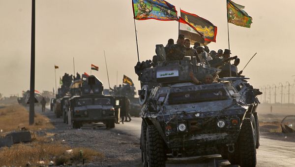 Iraqi forces deploy in the area of al-Shourah, some 45 kms south of Mosul, as they advance towards the city to retake it from the Islamic State (IS) group jihadists, on October 17, 2016 Iraqi forces deploy in the area of al-Shourah, some 45 kms south of Mosul, as they advance towards the city to retake it from the Islamic State (IS) group jihadists, on October 17, 2016 - Sputnik International