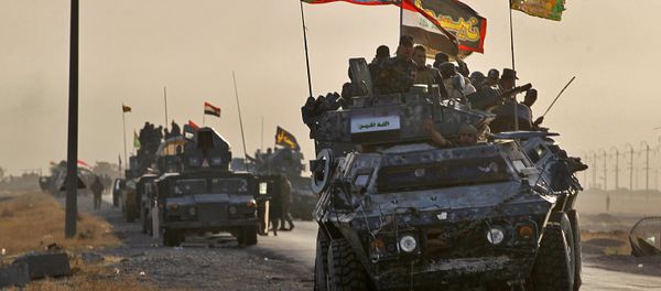 Iraqi forces deploy in the area of al-Shourah, some 45 kms south of Mosul, as they advance towards the city to retake it from the Islamic State (IS) group jihadists, on October 17, 2016 Iraqi forces deploy in the area of al-Shourah, some 45 kms south of Mosul, as they advance towards the city to retake it from the Islamic State (IS) group jihadists, on October 17, 2016 - Sputnik International