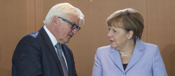 German Chancellor Angela Merkel (R) chats with German Foreign Minister Frank-Walter Steinmeier as she arrives for a weekly meeting of the German cabinet at the chancellery in Berlin on May 11, 2016 German Chancellor Angela Merkel (R) chats with German Foreign Minister Frank-Walter Steinmeier as she arrives for a weekly meeting of the German cabinet at the chancellery in Berlin on May 11, 2016 - Sputnik International