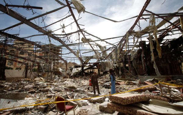 Member of the Specialized Criminal Prosecution Rajeh Zayed (L) responds to a call during a visit by human rights activists to a community hall that was struck by an air strike during a funeral on October 8, in Sanaa, Yemen, October 16, 2016 Member of the Specialized Criminal Prosecution Rajeh Zayed (L) responds to a call during a visit by human rights activists to a community hall that was struck by an air strike during a funeral on October 8, in Sanaa, Yemen, October 16, 2016 - Sputnik International