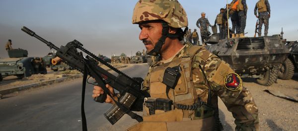 Iraqi forces gather in the area of al-Shourah, some 45 kms south of Mosul, as they advance towards the city to retake it from the Islamic State (IS) group jihadists, on October 17, 2016 Iraqi forces gather in the area of al-Shourah, some 45 kms south of Mosul, as they advance towards the city to retake it from the Islamic State (IS) group jihadists, on October 17, 2016 - Sputnik International