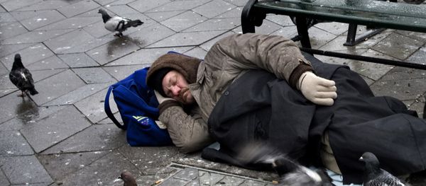 This is a January 2012 file photo of a homeless man sleeping in Townhall Square in Copenhagen - Sputnik International