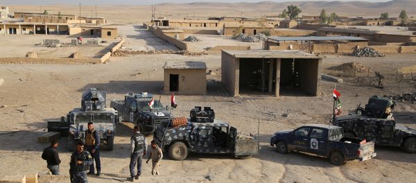 Iraqi security forces gather in Qayara, south of Mosul, to attack Islamic State militants in Mosul, Iraq, October 18, 2016 Iraqi security forces gather in Qayara, south of Mosul, to attack Islamic State militants in Mosul, Iraq, October 18, 2016 - Sputnik International