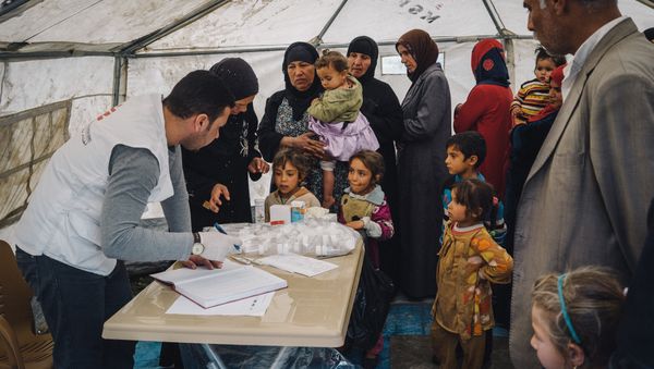 Civilians displaced by heavy fighting between Iraqi security forces and ISIS militants wait to be seen by a doctor in a tent set up by MSF, or Doctors Without Borders, to provide medical aid at a shelter in Makhmour, near Mosul, Iraq, March 28, 2016 Civilians displaced by heavy fighting between Iraqi security forces and ISIS militants wait to be seen by a doctor in a tent set up by MSF, or Doctors Without Borders, to provide medical aid at a shelter in Makhmour, near Mosul, Iraq, March 28, 2016 - Sputnik International